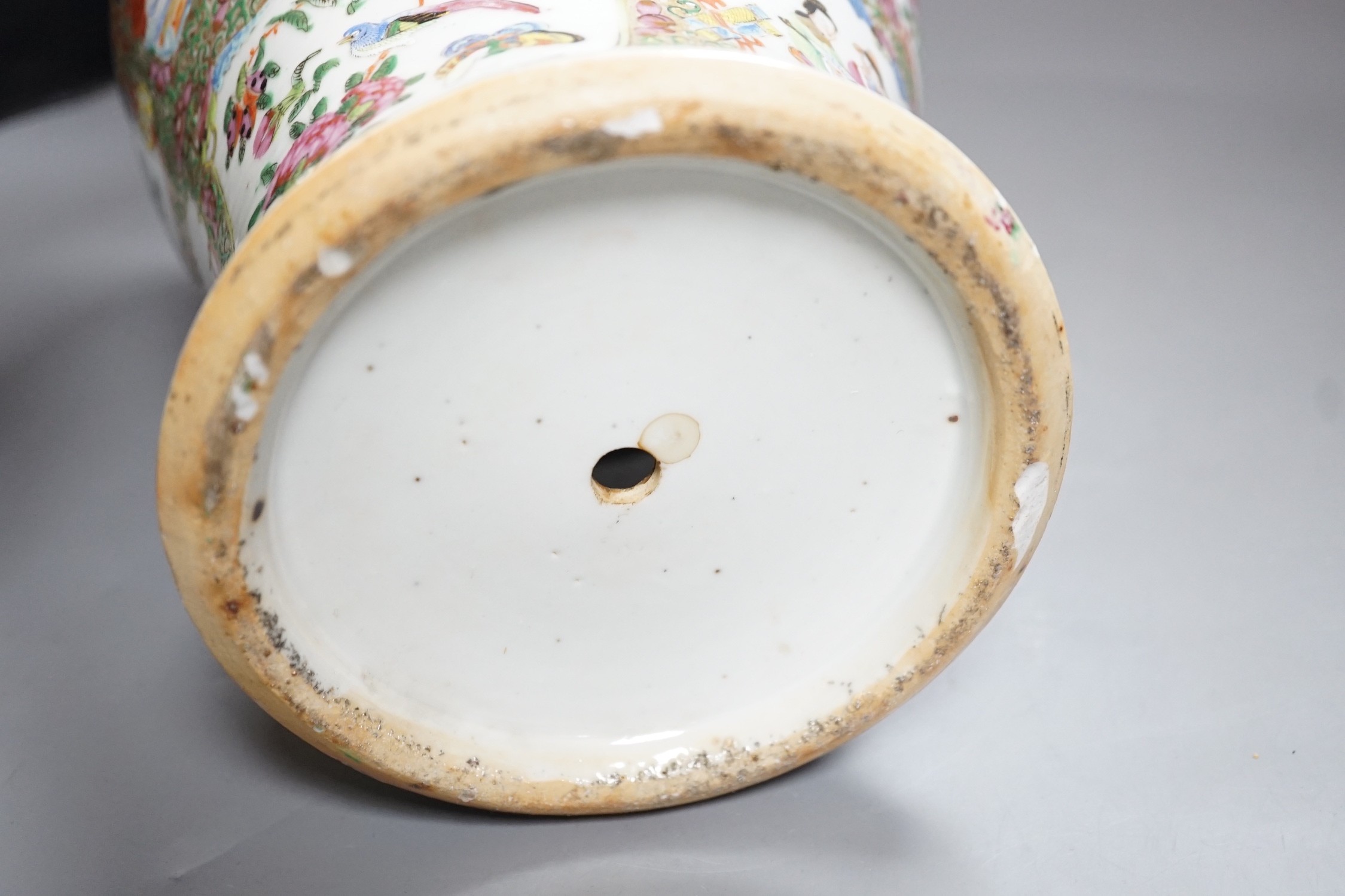 A 19th century Cantonese famille rose baluster vase and cover, the latter lacking a knop finial, 38cms high